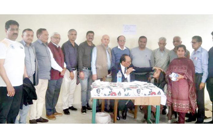 A doctor examining a patient during a medical camp at Gujroo Nagrota in Billawar.