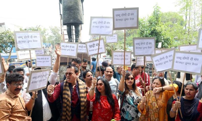 Artists holding placards during a peaceful rally in Jammu on Wednesday. -Excelsior/Rakesh
