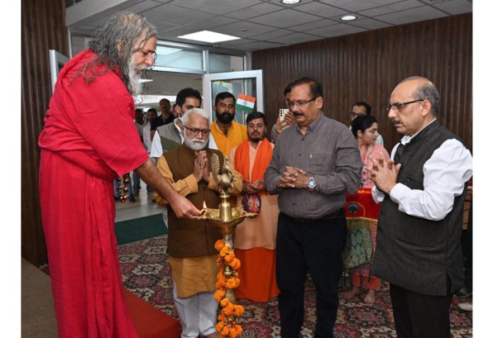 Vishwatmananda Saraswati lighting ceremonial lamp in presence of CUJ VC and others.