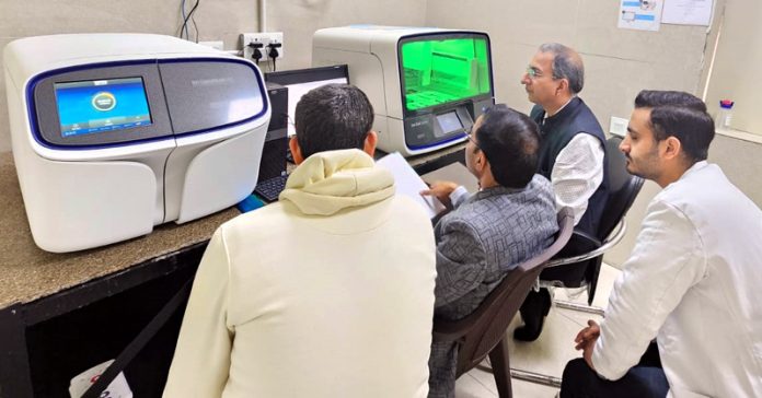 HoD Microbiology in GMC Jammu, Dr Sandeep Dogra and his subordinates doing cancer genetic testing on NGS equipment. HoD Microbiology in GMC Jammu, Dr Sandeep Dogra and his subordinates doing cancer genetic testing on NGS equipment.