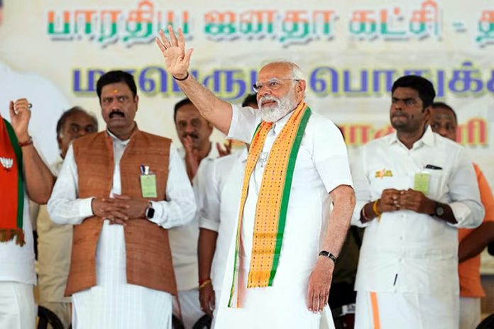 Prime Minister Narendra Modi waves to supporters during a public meeting, ahead of the Lok Sabha election, in Kanyakumari. Prime Minister Narendra Modi waves to supporters during a public meeting, ahead of the Lok Sabha election, in Kanyakumari.