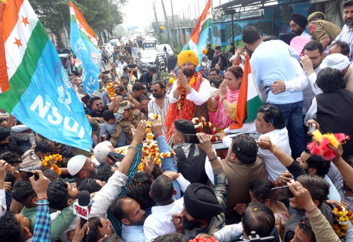 Ex-MP Ch. Lal Singh being received by Cong workers and his supporters outside Jammu airport on Thursday. -Excelsior/Rakesh