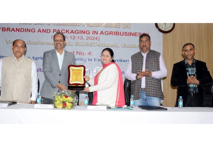 Memento being presented to chief guest during inaugural of training programme at SKUAST-Jammu.