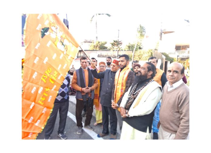 Pawan Kumar Shastri flagging off the bus.