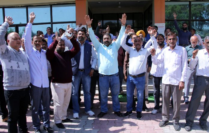 PHE employees staging protest outside Chief Engg’s office in Jammu on Wednesday. PHE employees staging protest outside Chief Engg’s office in Jammu on Wednesday.