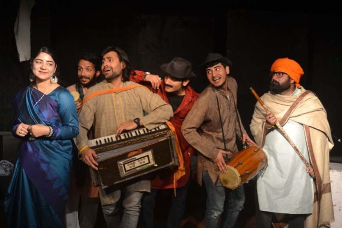 A scene from Hindi play 'Tauba Tauba' staged by Natrang at Jammu on Sunday.