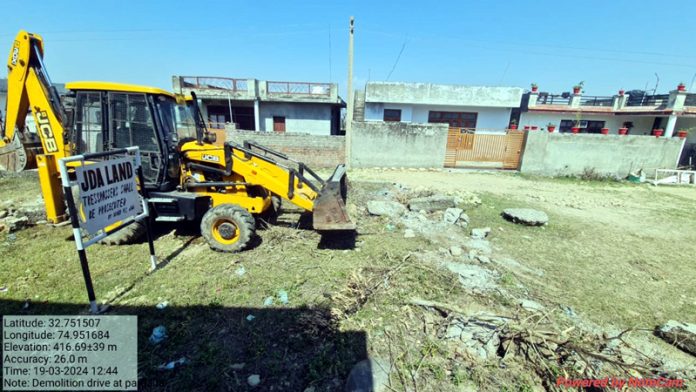 Illegal construction being removed from JDA land.