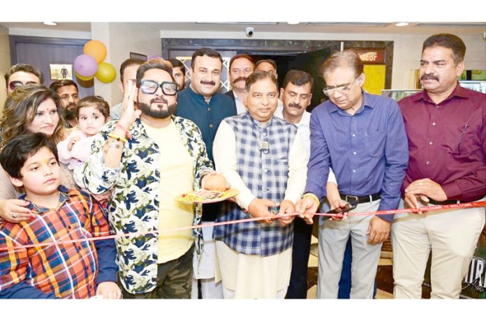 Former Minister, Sat Sharma releasing short film on Ayushman Bharat and Jan Aushadhi at Jammu on Thursday.