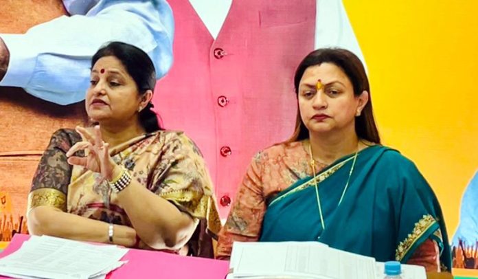BJP senior leaders, Priya Sethi and Rekha Mahajan at a party function at Jammu on Wednesday.