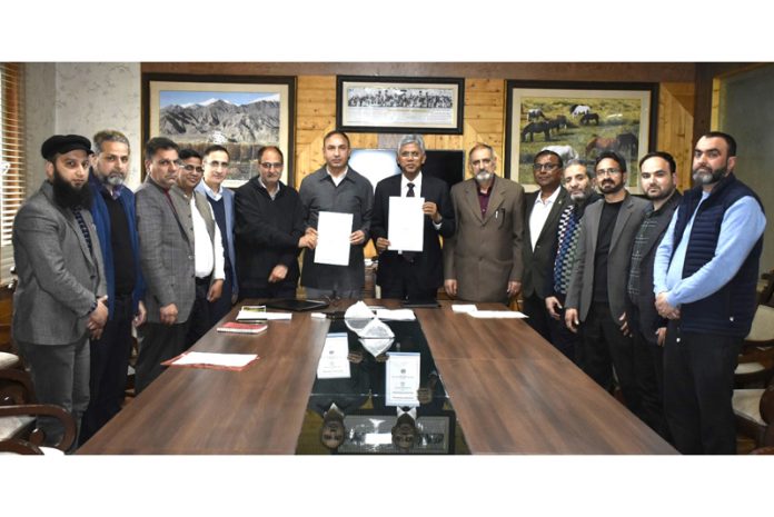 Director IIM Jammu and Vice-Chancellor of SKUAST Kashmir displaying copies of MoU signed between the two institutions.
