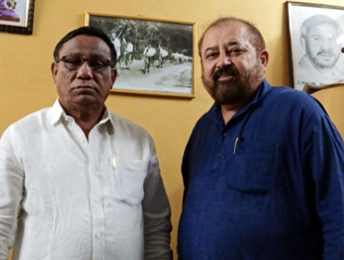 J&K BSP leader Rajesh Gupta pose for a photograph with Karnataka BSP president, Marasandra Muniyappa.