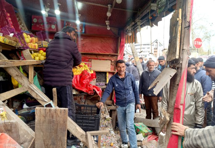 SMC enforcement wing during the demolition drive at Dalgate on Saturday. -Excelsior/Shakeel