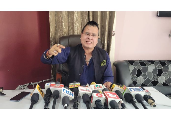 Senior AAP leader Jayesh Gupta addressing a press conference at Jammu.