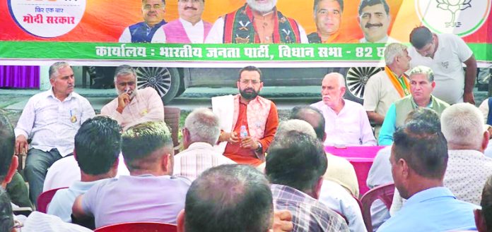 Narinder Singh Bhau along with Shamsher Singh Manhas addressing during a party workers meeting in Chhamb constituency on Wednesday. Narinder Singh Bhau along with Shamsher Singh Manhas addressing during a party workers meeting in Chhamb constituency on Wednesday.