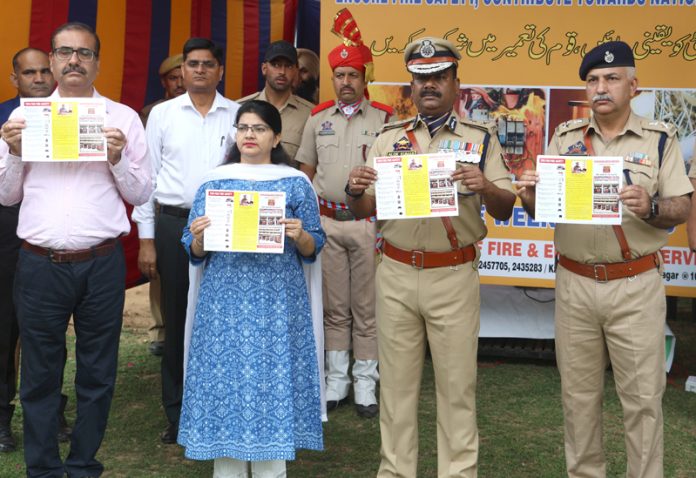 ADGP Alok Kumar and others releasing a pamphlet on Fire & Emergency Services. -Excelsior/Rakesh ADGP Alok Kumar and others releasing a pamphlet on Fire & Emergency Services. -Excelsior/Rakesh