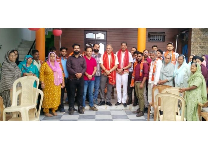 BJP leader Kavinder Gupta along with the people, who joined the party during a programme in Jammu on Wednesday.