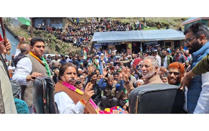 Senior Cong leader Raman Bhalla and former Minister Abdul Gani Malik during election rally in Mahore.