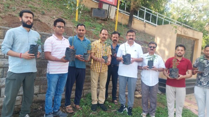 ADC Udhampur and others carrying rose saplings for plantation along Devika in Udhampur. ADC Udhampur and others carrying rose saplings for plantation along Devika in Udhampur.