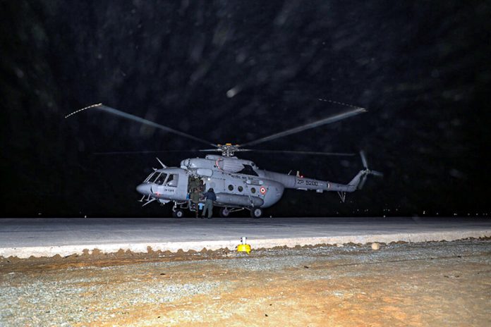 An IAF helicopter lands on Wanpoh-Sangam stretch of the Jammu-Srinagar National Highway on Tuesday. An IAF helicopter lands on Wanpoh-Sangam stretch of the Jammu-Srinagar National Highway on Tuesday.