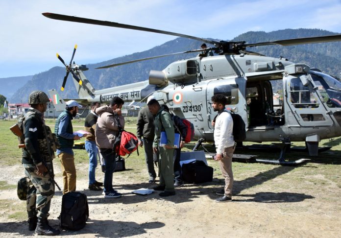 A polling party being airlifted to a hilly area in Kishtwar district on Wednesday.