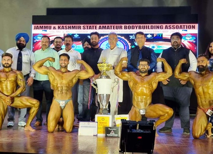Former Deputy CM J&K, Kavinder Gupta posing along with Bodybuilders at Jammu on Sunday. -Excelsior/Rakesh Former Deputy CM J&K, Kavinder Gupta posing along with Bodybuilders at Jammu on Sunday. -Excelsior/Rakesh