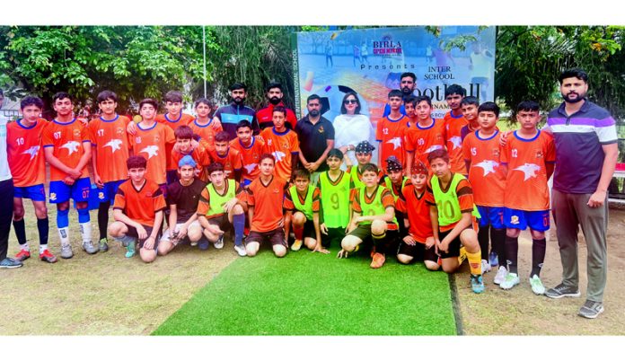 School team posing along with faculty during an Inter School Football Championship on Monday. 