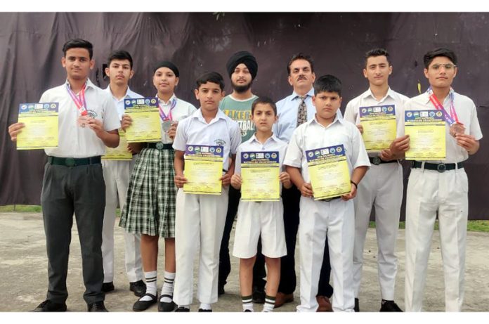 Martial art athletes of Delhi Public School Kathua posing along with medals and certificates. Martial art athletes of Delhi Public School Kathua posing along with medals and certificates.