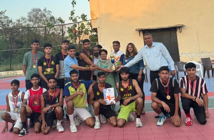 Dignitaries posing along with the winning team during a Basketball Championship at Jammu. Dignitaries posing along with the winning team during a Basketball Championship at Jammu.