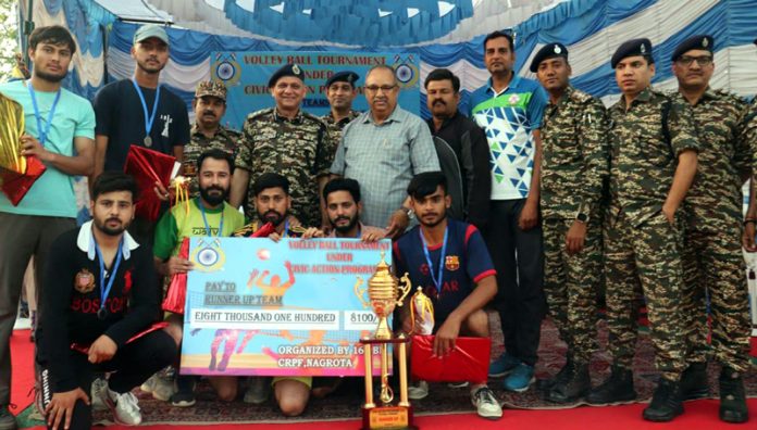 Hariom Khare, Commandant 160 Battalion CRPF posing along with the winning team at Nagrota on Monday.