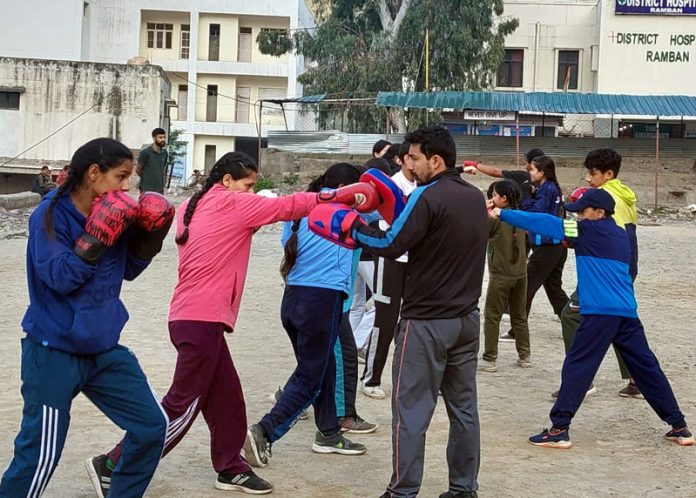 Sandeep Singh Chib, a boxing coach giving tips to aspiring boxers during a training session at Ramban.