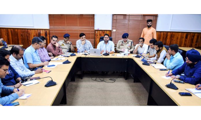 Returning Officer Jammu PC chairing a meeting.