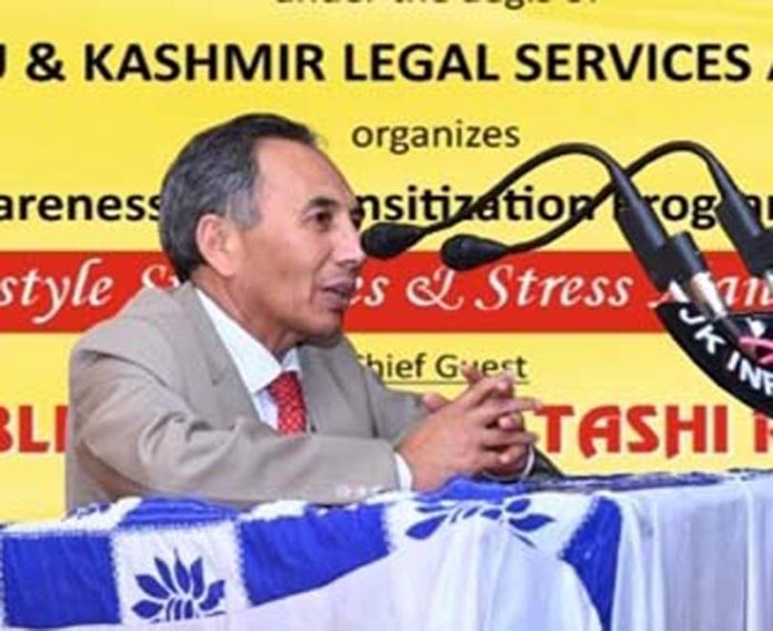 Justice Tashi Rabstan, Judge, J&K and Ladakh High Court addressing participants during an awareness programme at District Court Complex, Jammu.