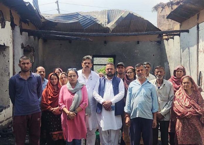 Preeti Khajuria & others visiting the family whose house was gutted in fire. Preeti Khajuria & others visiting the family whose house was gutted in fire.