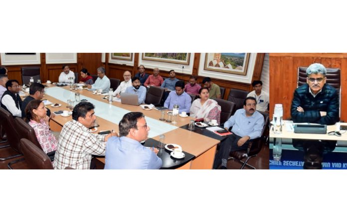 Chief Secretary Atal Dulloo chairing a meeting on Monday.