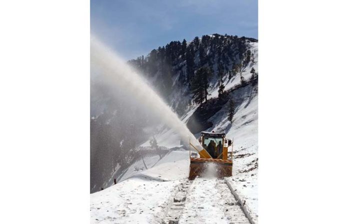 A BRO machine clearing snow at Chattergalla Pass on Bhaderwah-Bani road on Thursday. -Excelsior/Tilak Raj A BRO machine clearing snow at Chattergalla Pass on Bhaderwah-Bani road on Thursday. -Excelsior/Tilak Raj