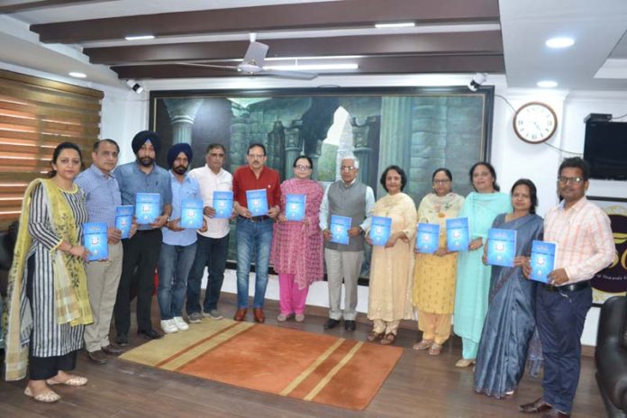 Vice-Chancellor Prof Umesh Rai and others releasing JU research journal.