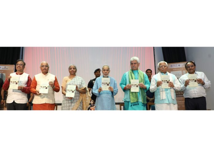 Union Finance Minister, J&K LG and other dignitaries releasing a book at New Delhi.