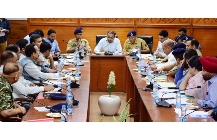 Div Com, ADGP chairing a meeting.