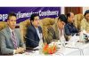 Observers chairing a meeting at Srinagar.