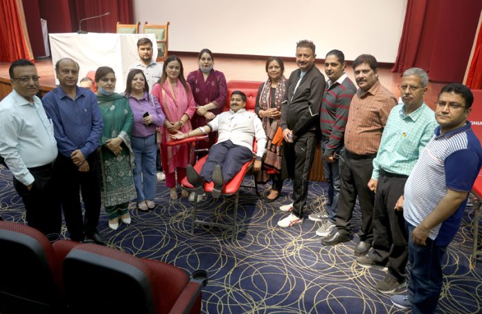 Gaurav Gupta donating blood during camp organized by Jammu Club and Thalassemia Welfare Society. -Excelsior/Rakesh