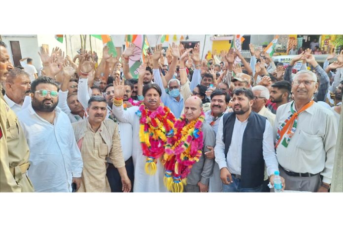 Cong candidate Raman Bhalla flanked by ex-DyCM Tara Chand taking out election rally in Akhnoor. Cong candidate Raman Bhalla flanked by ex-DyCM Tara Chand taking out election rally in Akhnoor.