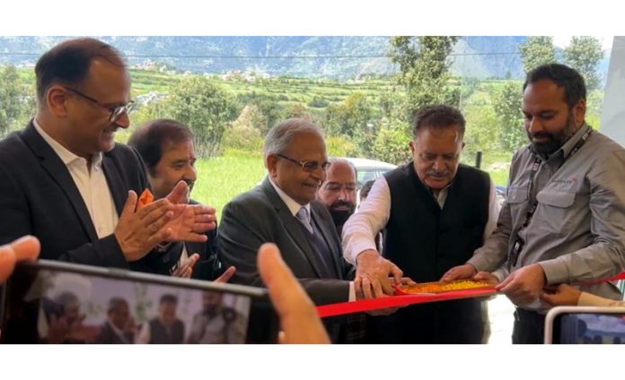 Swatantar Aggarwal, Chairman of Aggarwal Group and Tanvir Kichloo inaugurating new showroom of Mahindra in Kishtwar on Sunday.