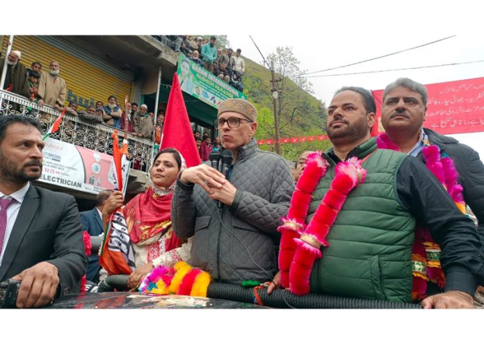 NC vice president Omar Abdullah, flanked by PCC Chief Vikar Rasool Wani addressing public rally at Banihal.
