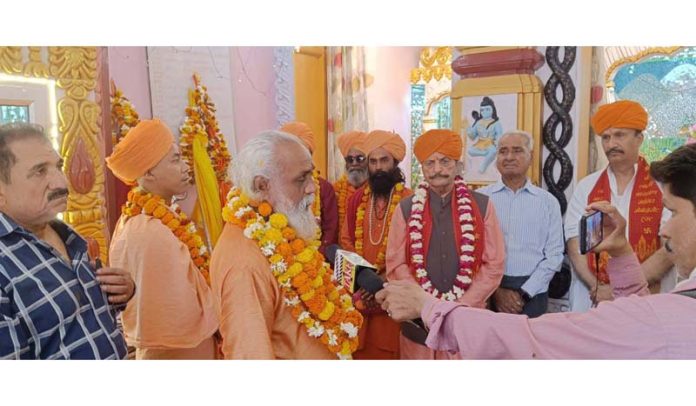 Priests along with dignitaries at the historical Shiva Temple in Purmandal.