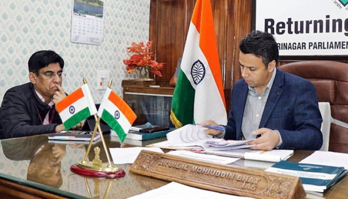 RO examining documents on Friday.