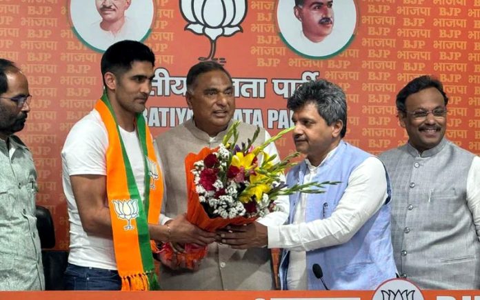 Boxer Vijender Singh Joins BJP in New Delhi on Wednesday. Boxer Vijender Singh Joins BJP in New Delhi on Wednesday.