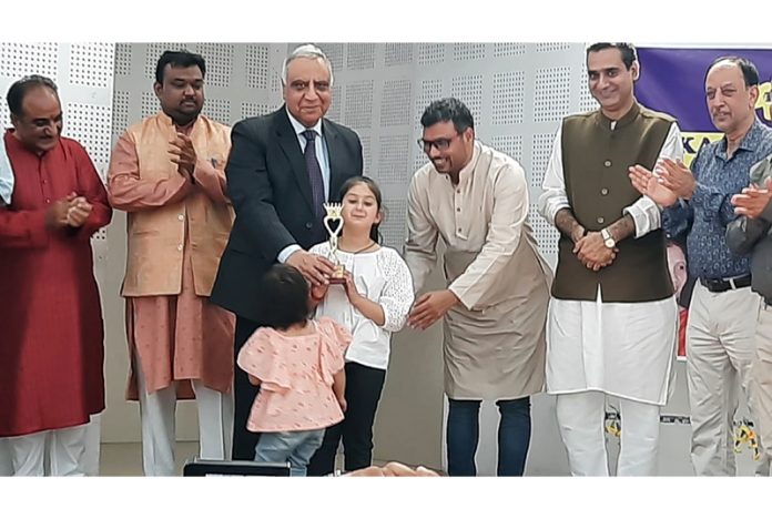 Dignitaries honouring a young girl at a seminar on Trika philosophy at Jammu on Saturday.