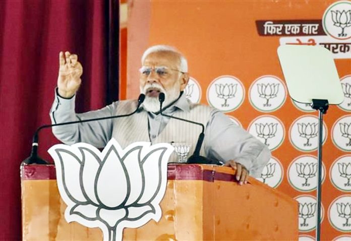 Prime Minister Narendra Modi during a rally at Jalpaiguri on Sunday. Prime Minister Narendra Modi during a rally at Jalpaiguri on Sunday.