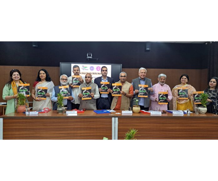 Guests launching a journal of Jonaraja Institute of Genocide & Atrocities Studies during a workshop at IIMC Jammu.