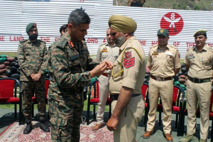 GOC-in-C, Northern Command, conferring an award on JKP HC Agya Singh at Buddhal area of Rajouri District on Monday. GOC-in-C, Northern Command, conferring an award on JKP HC Agya Singh at Buddhal area of Rajouri District on Monday.